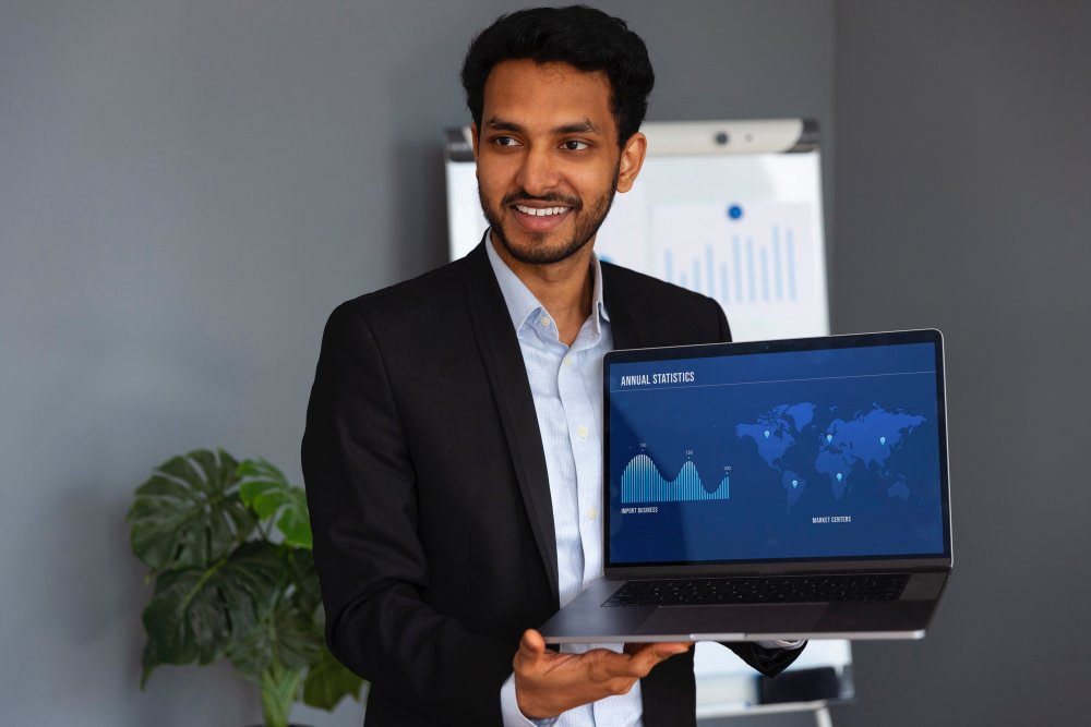 Business leader reviewing annual statistics and market-centre growth on a laptop dashboard — scaling operations with SAP Business One