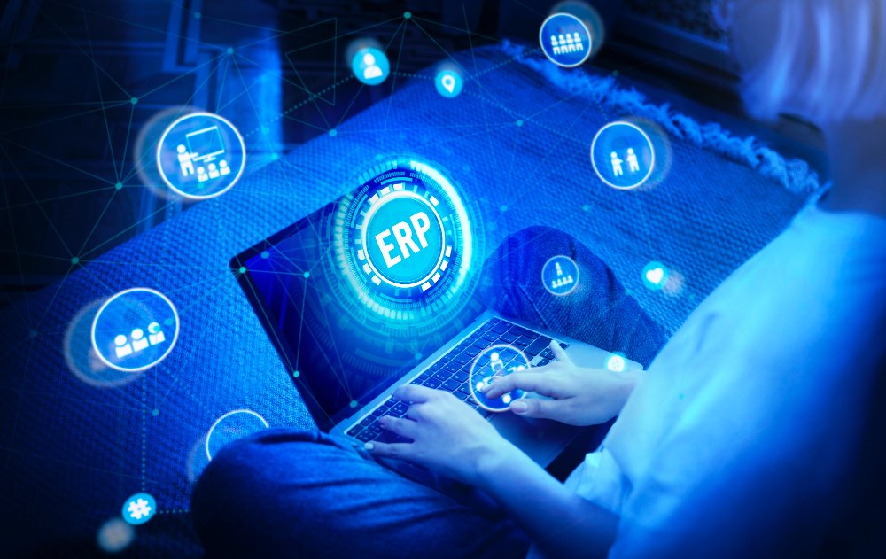 Abstract illustration of a connected SAP Business One ERP network linking branch locations, with a person working on a laptop